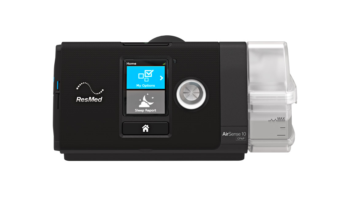 Black ResMed AirSense 10 device with a front display, silver control dial, and water chamber on the right